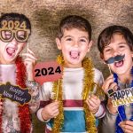 Three,kids,celebrating,new,years,eve.,2024!