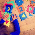 Little,girl,playing,with,puzzle,,early,education